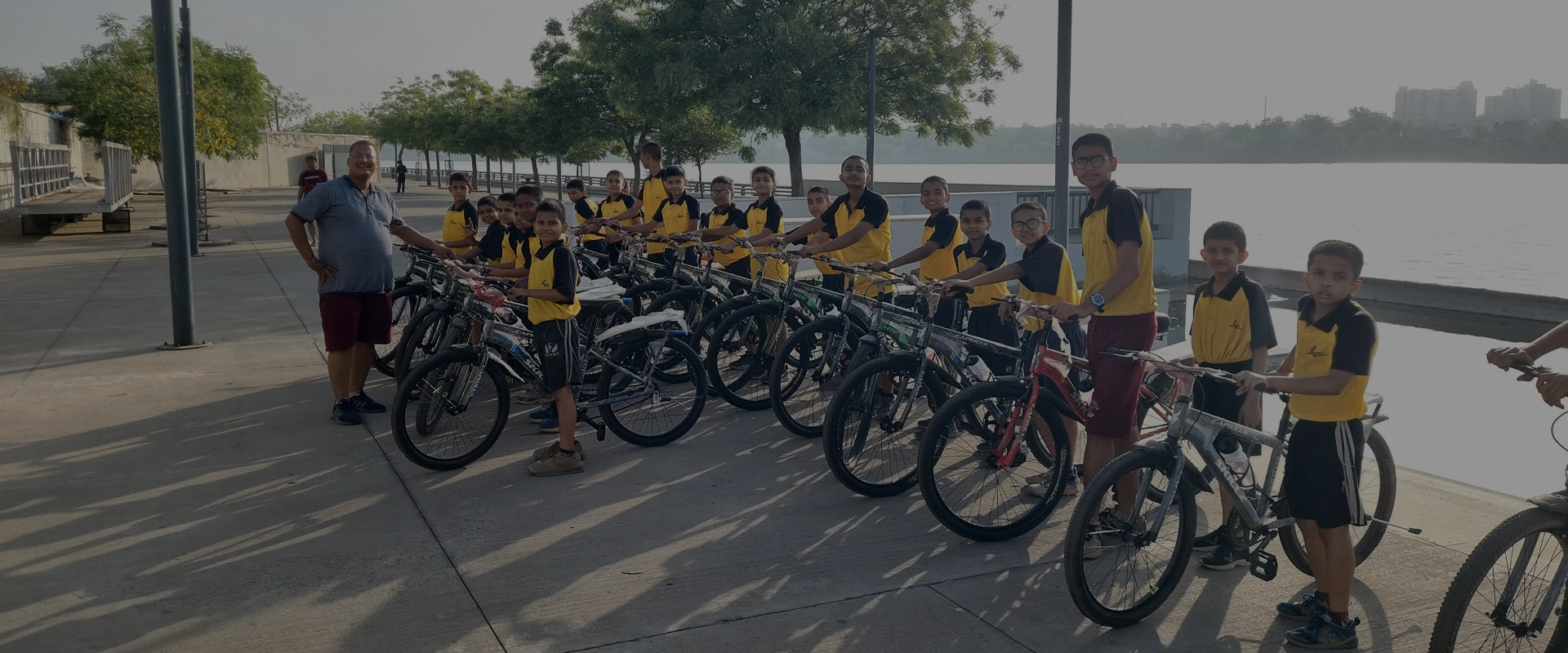 Career Express students and a teacher with bicycles at the riverfront